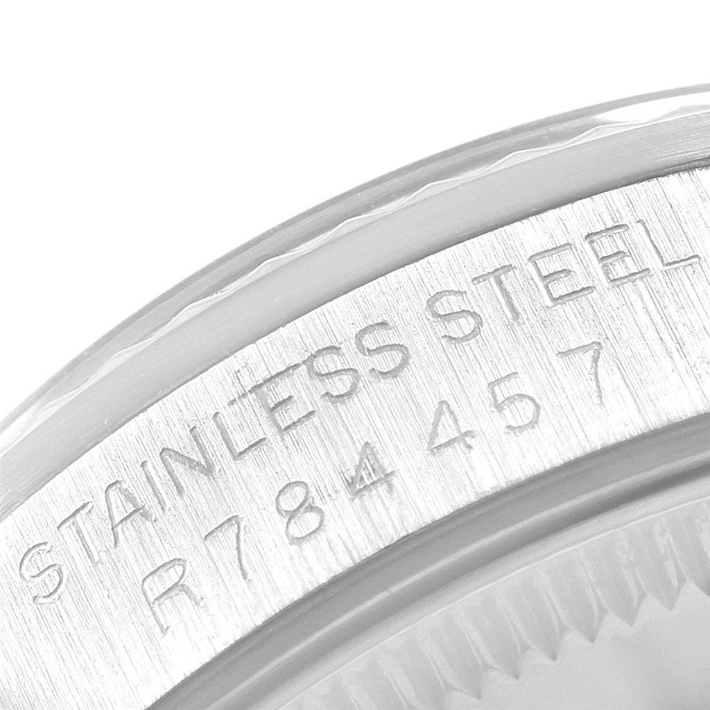 This close-up image shows the engraved stainless steel case back of a Rolex Mid-Size 68274 Women
s Stainless Steel Silver Dial 68274 Women
s Stainless Steel Silver Dial model watch, featuring part of the serial number.