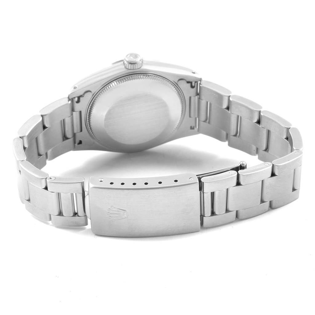 This image shows the back casing and bracelet of the Mid-Size Rolex watch, including the clasp with the Rolex crown logo.