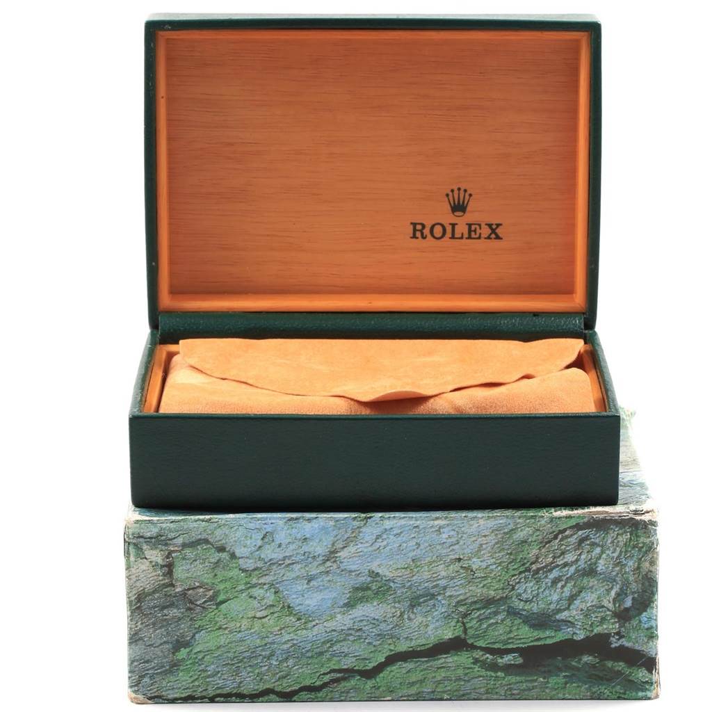 The image shows an open Rolex box for a Mid-Size model watch, revealing its interior but not the watch itself.