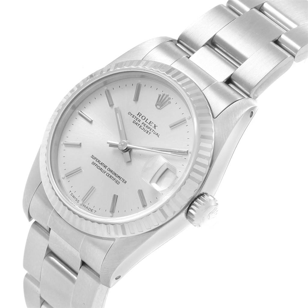 The image shows a Rolex Mid-Size 68274 Women
s Stainless Steel Silver Dial 68274 Women
s Stainless Steel Silver Dial Oyster Perpetual Datejust watch from an angled side view, highlighting the dial, bezel, crown, and bracelet.