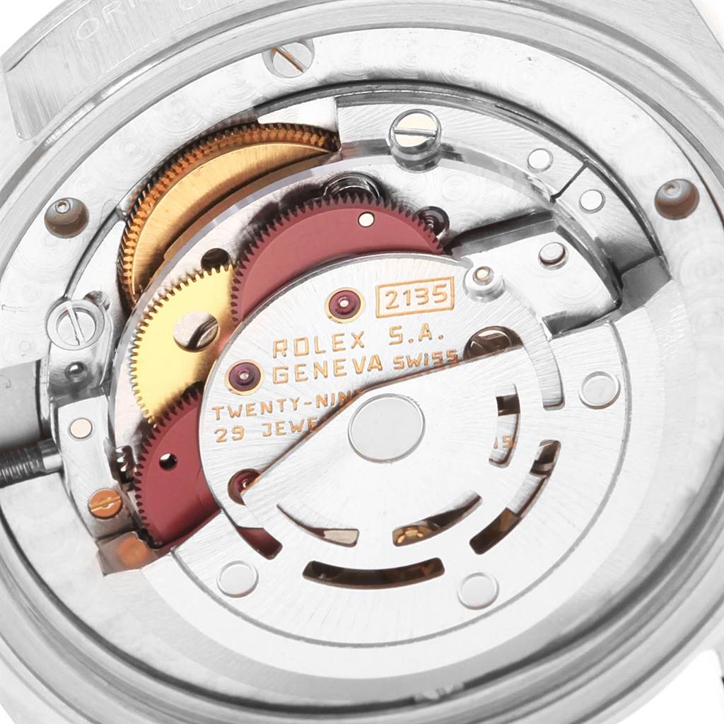 This image shows the internal mechanism and movement of a Rolex Mid-Size 68274 Women
s Stainless Steel Silver Dial 68274 Women
s Stainless Steel Silver Dial watch from a close-up angle.