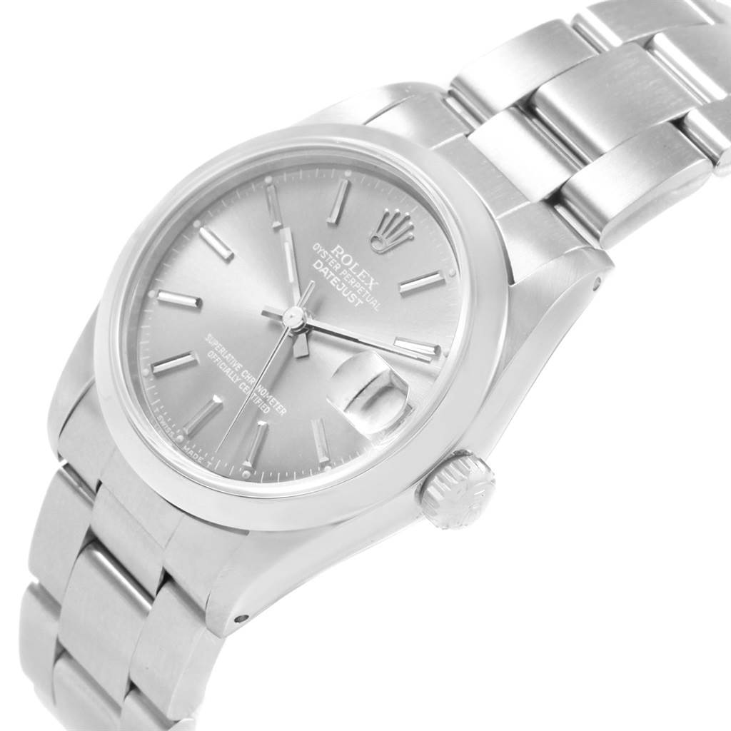 The image shows a side angle of a Rolex Mid-Size 68240 Women's Stainless Steel Grey Dial 68240 Women's Stainless Steel Grey Dial Datejust watch, highlighting the face, bezel, crown, and part of the bracelet.