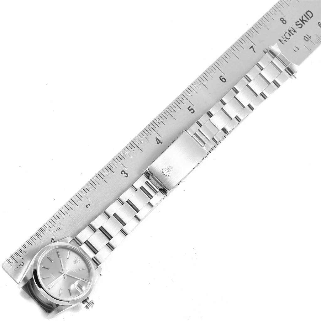 The image shows a top-down view of a Rolex Mid-Size 68240 Women's Stainless Steel Grey Dial 68240 Women's Stainless Steel Grey Dial watch with a stainless steel bracelet measured against a ruler.