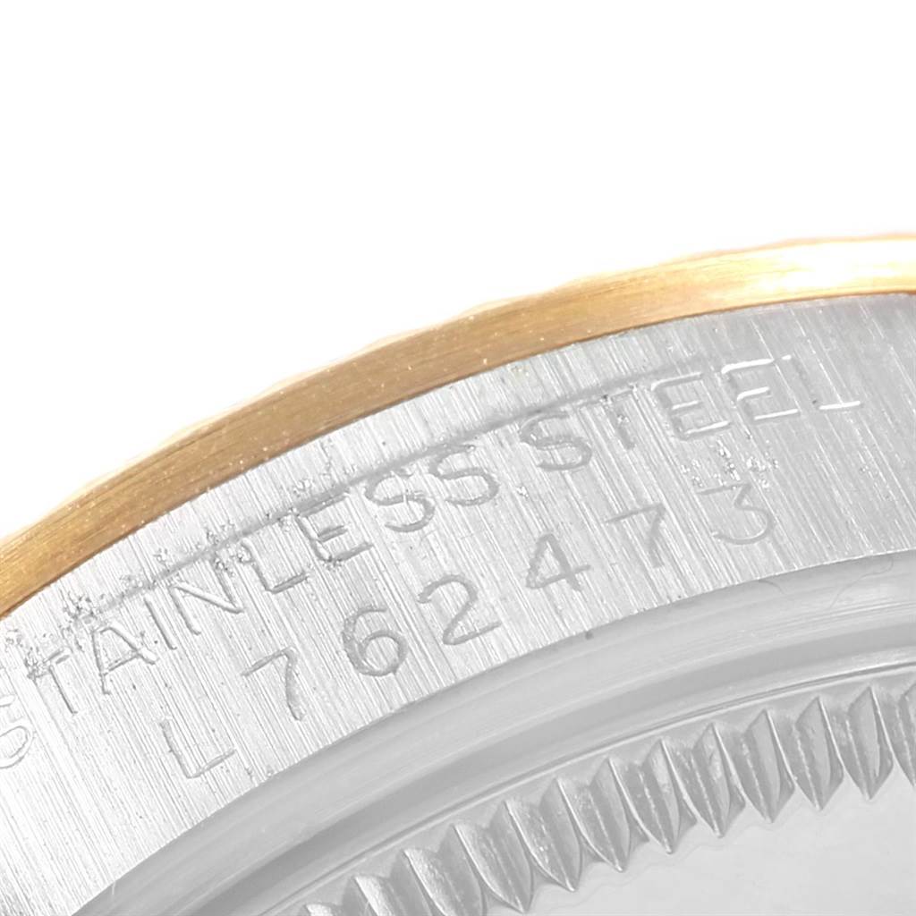 The image shows a close-up of the Rolex Mid-Size 68273 Women's Steel and Gold (two tone) Champagne Dial 68273 Women's Steel and Gold (two tone) Champagne Dial watch's case side, highlighting the stainless steel engravings and part of the bezel.