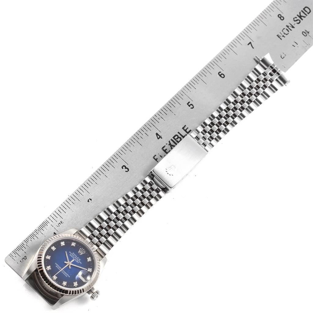 The image shows a Rolex Mid-Size 68274 Women's Stainless Steel Blue Dial 68274 Women's Stainless Steel Blue Dial watch with a blue dial and silver bracelet, measured alongside a ruler.