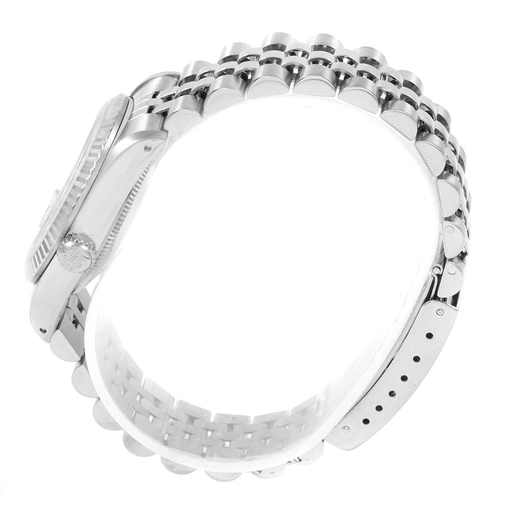 The image shows a side view of the Rolex Mid-Size 68274 Women's Stainless Steel Blue Dial 68274 Women's Stainless Steel Blue Dial model watch, focusing on the case, crown, and bracelet.