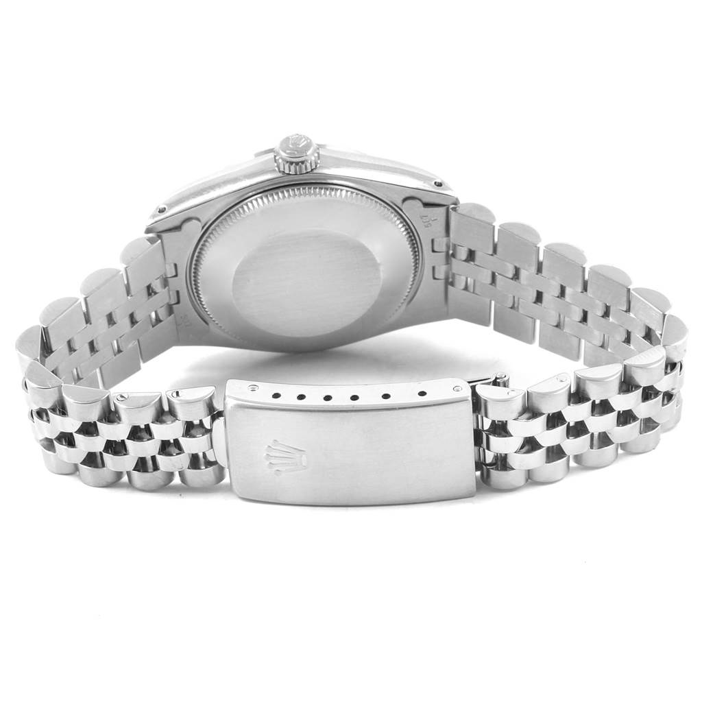 This image shows the backside of a Rolex Mid-Size 68274 Women's Stainless Steel Blue Dial 68274 Women's Stainless Steel Blue Dial watch, displaying the case back, crown, and the bracelet with a clasp.