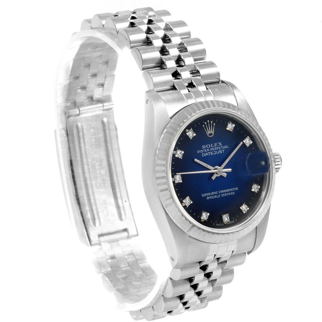The image shows a Rolex Mid-Size 68274 Women's Stainless Steel Blue Dial 68274 Women's Stainless Steel Blue Dial Oyster Perpetual Datejust watch at a slight angle, displaying its face, bezel, crown, and part of the bracelet.