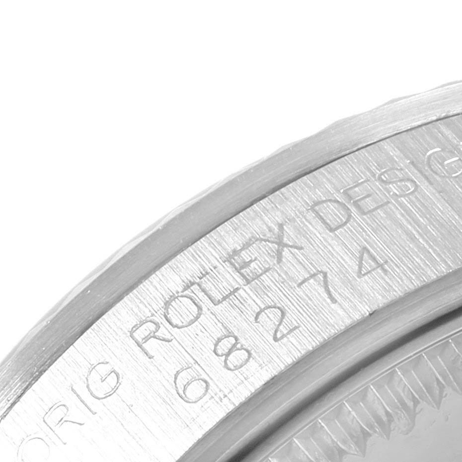 The image shows a close-up view of the Rolex Mid-Size 68274 Women's Stainless Steel Blue Dial 68274 Women's Stainless Steel Blue Dial watch's case back engraving.