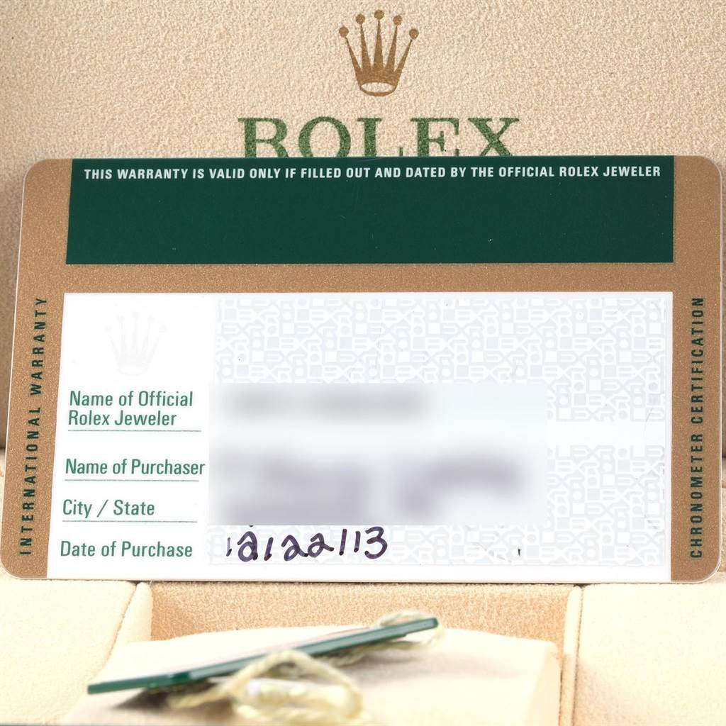 The image shows a warranty card and tag for a Mid-Size Rolex watch, along with the Rolex branding and logo.