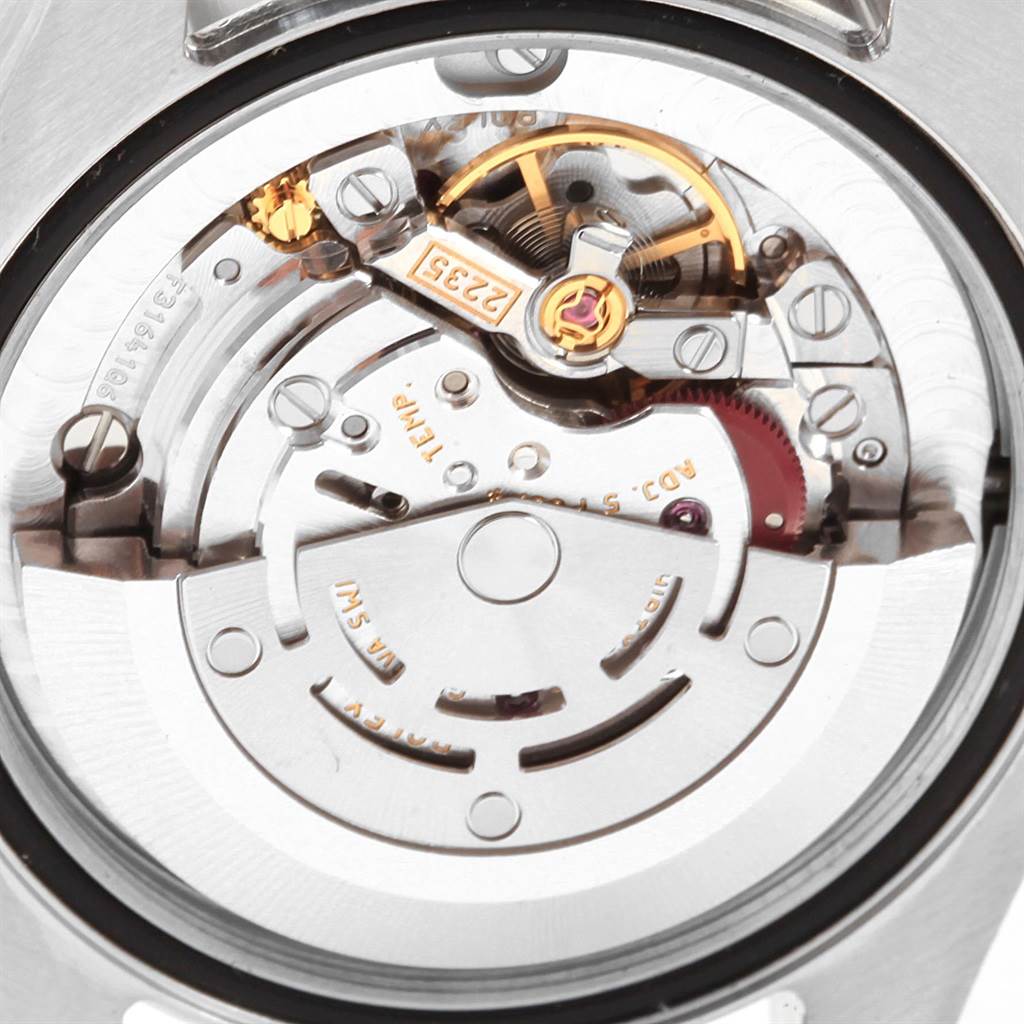 The image shows the movement mechanism of a Mid-Size Rolex watch viewed from the back case.