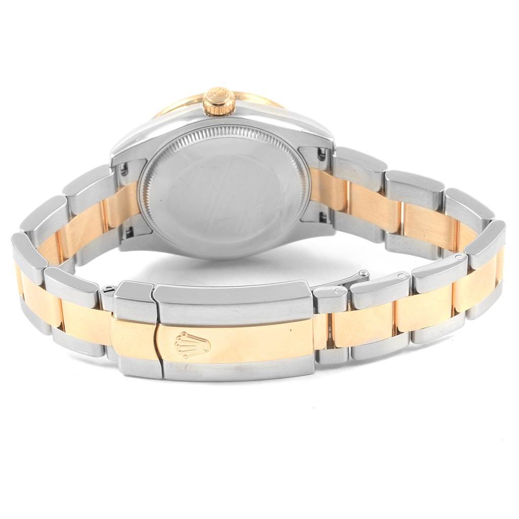 The Rolex Mid-Size 178383 Women's Steel and Gold (two tone) Silver Dial 178383 Women's Steel and Gold (two tone) Silver Dial watch is shown from the back, highlighting its two-tone metal bracelet and clasp.