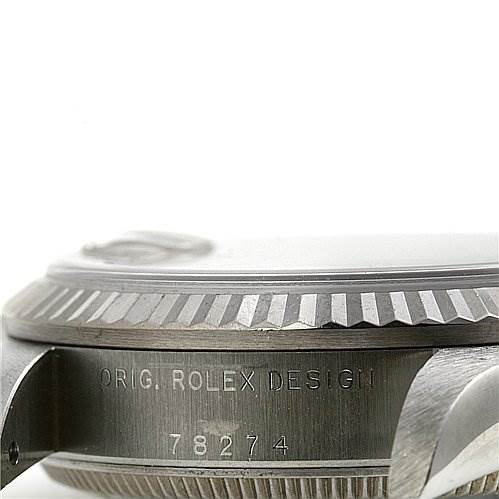 The image shows a side view of the case of a Mid-Size Rolex watch, highlighting the engraved serial number and bezel.