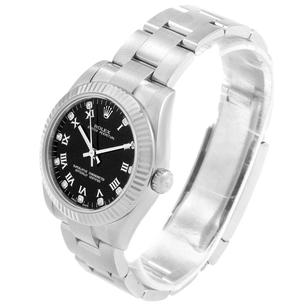 The image shows a mid-size Rolex Oyster Perpetual watch at a three-quarter angle, highlighting the dial, bezel, crown, and bracelet.