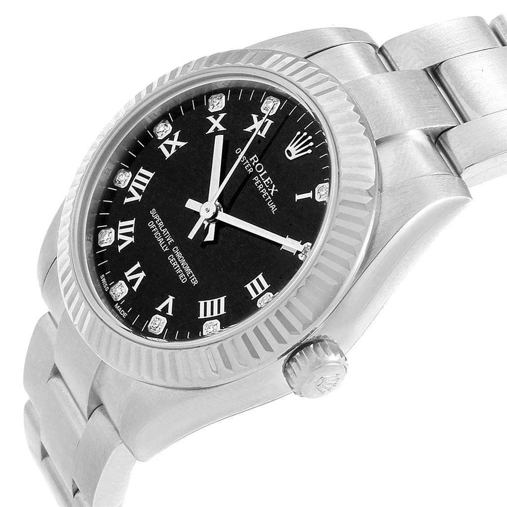 The Rolex Mid-Size 177234 Women's Stainless Steel Black Dial 177234 Women's Stainless Steel Black Dial watch is shown at an angled view highlighting its black dial, fluted bezel, crown, and a portion of the bracelet.