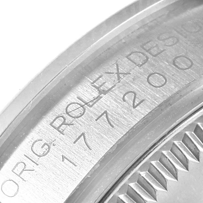 This is a close-up shot of the case back engraving on a Mid-Size Rolex watch.