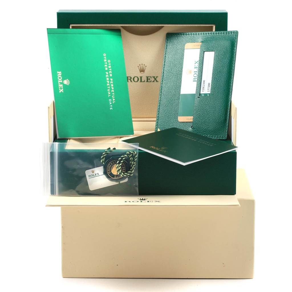 The image shows a Rolex Mid-Size 177200 Women's Stainless Steel Burgundy Dial 177200 Women's Stainless Steel Burgundy Dial watch package, including manuals, a warranty card, a card holder, and a tag, from a front angle.
