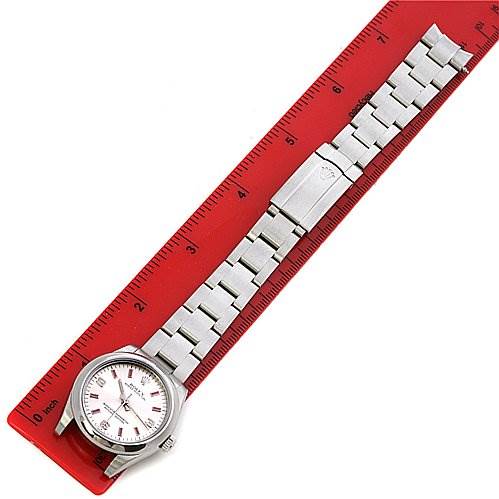 The Rolex Mid-Size 177200 Women's Stainless Steel Silver Dial 177200 Women's Stainless Steel Silver Dial model watch is shown laid flat with its face, bracelet, and clasp visible alongside a red ruler.