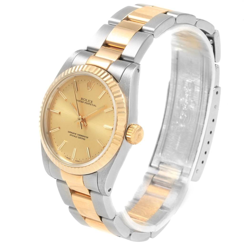 The image shows a Rolex Oyster Perpetual Mid-Size watch from an angled side view, displaying its two-tone bracelet, case, and dial.