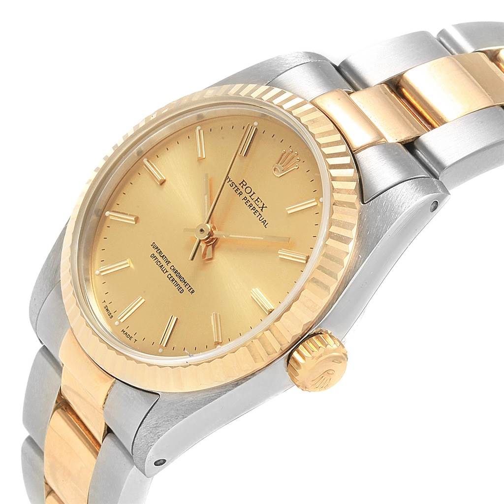 This image shows a side angle of a Rolex Mid-Size 67513 Women's Steel and Gold (two tone) Champagne Dial 67513 Women's Steel and Gold (two tone) Champagne Dial model watch, highlighting the dial, bezel, crown, and part of the bracelet.