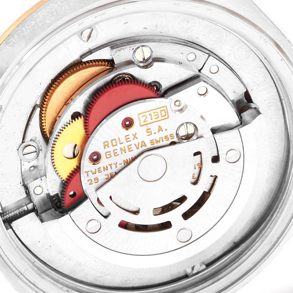 This image shows a close-up view of the intricate movement mechanism inside a Rolex Mid-Size 67513 Women's Steel and Gold (two tone) Champagne Dial 67513 Women's Steel and Gold (two tone) Champagne Dial watch.