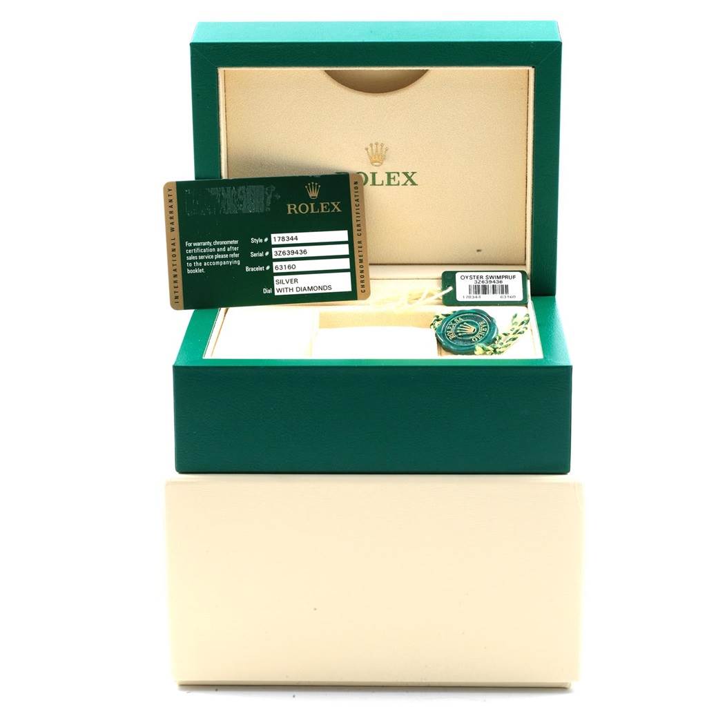 The image shows a Rolex Mid-Size 178344 Women's Stainless Steel Silver Dial 178344 Women's Stainless Steel Silver Dial watch box with tags, warranty card, and a seal inside an open green box.