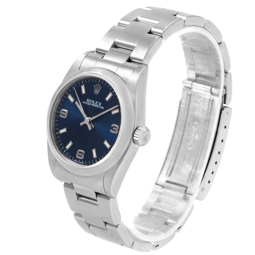 The image shows a mid-size Rolex Oyster Perpetual watch from an angled side view, highlighting the face, crown, and bracelet.