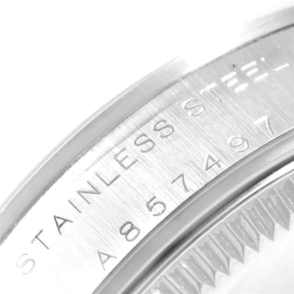 This image shows a close-up of the stainless steel caseback of a Rolex Mid-Size 77080 Women's Stainless Steel Black Dial 77080 Women's Stainless Steel Black Dial model, highlighting its engraving.