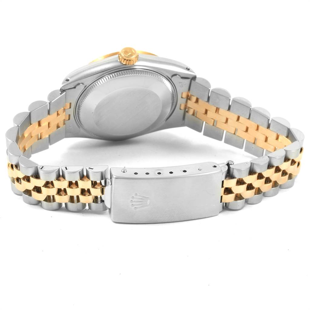 This image shows the back and bracelet, including the clasp and crown, of a Rolex Mid-Size 68273 Women's Steel and Gold (two tone) Blue Dial 68273 Women's Steel and Gold (two tone) Blue Dial model watch.