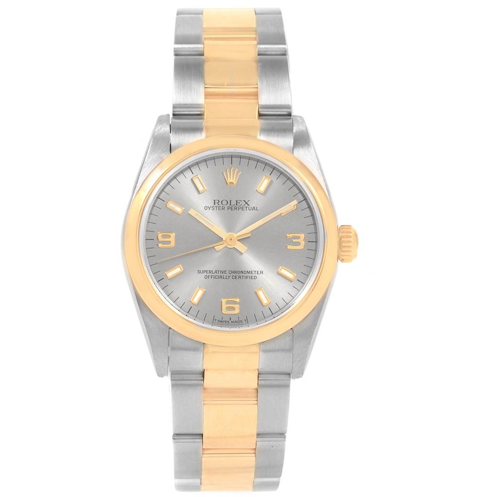 The Rolex Mid-Size 77483 Women's Steel and Gold (two tone) Grey Dial 77483 Women's Steel and Gold (two tone) Grey Dial watch is shown from a front angle, displaying its face and bracelet.