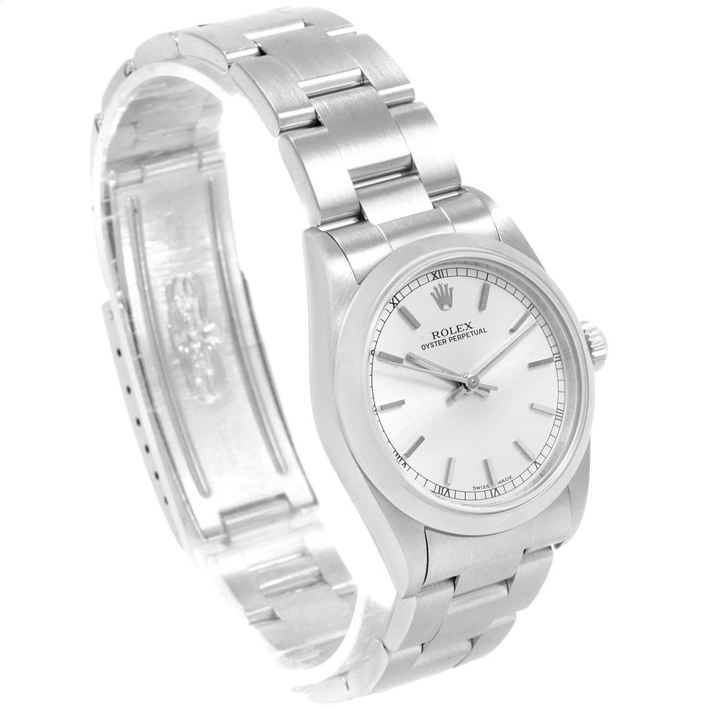 The image shows a raised, angled view of a Rolex Oyster Perpetual Mid-Size watch, displaying the dial, case, and bracelet.