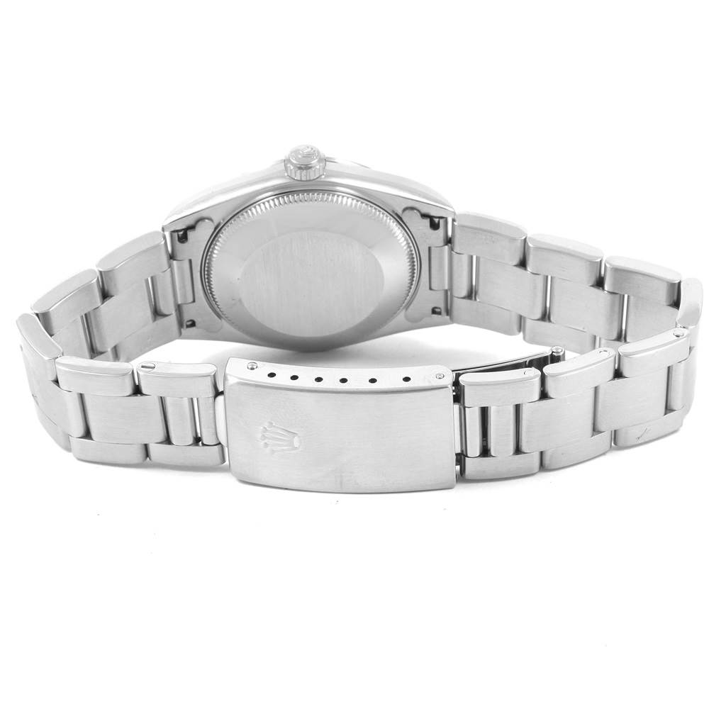 The image shows the back view of a Mid-Size Rolex watch, including the case back and the bracelet with the clasp.
