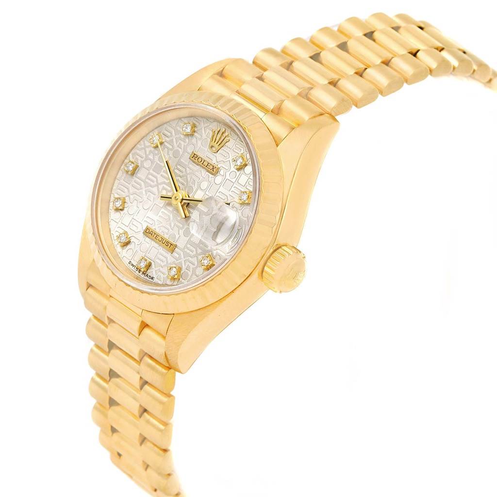 The Rolex Mid-Size 68278 Women's Yellow Gold Silver Dial 68278 Women's Yellow Gold Silver Dial model watch is shown at a tilted angle, highlighting its gold case, bracelet, crown, and dial with diamond markers.