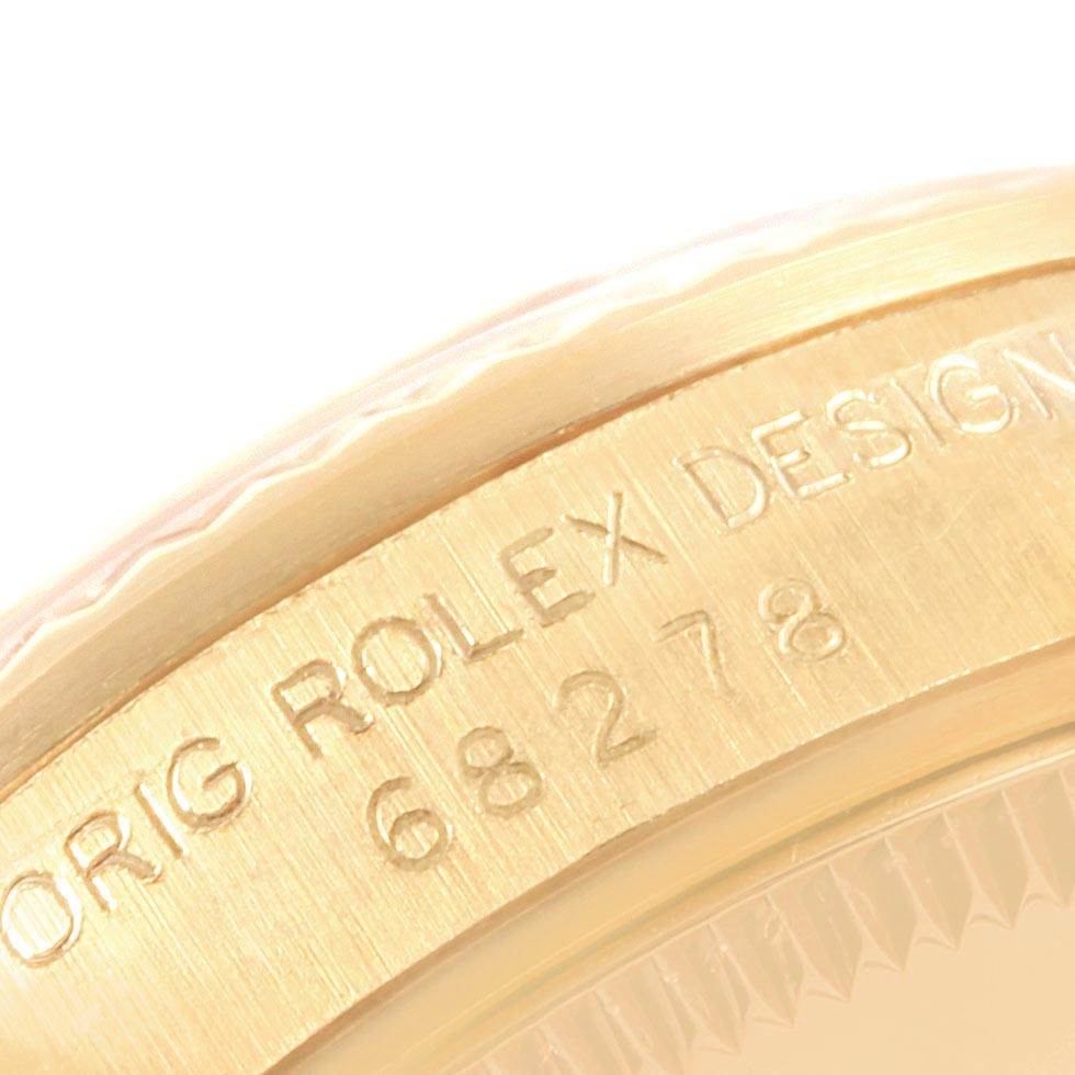 The image shows a close-up angle of the engraved serial number and branding on the case side of a Rolex Mid-Size 68278 Women's Yellow Gold Silver Dial 68278 Women's Yellow Gold Silver Dial watch.