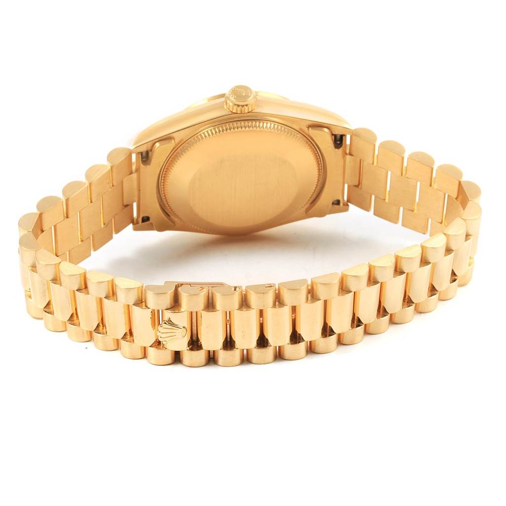The image shows the back view of a Rolex Mid-Size 68278 Women's Yellow Gold Silver Dial 68278 Women's Yellow Gold Silver Dial model watch, highlighting the case back and bracelet.