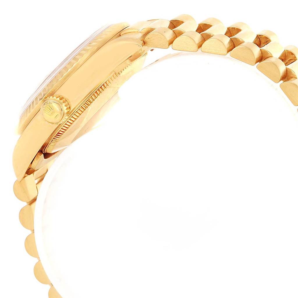 The image shows a side view of a Rolex Mid-Size 68278 Women's Yellow Gold Silver Dial 68278 Women's Yellow Gold Silver Dial watch, focusing on the gold case, crown, and part of the bracelet.