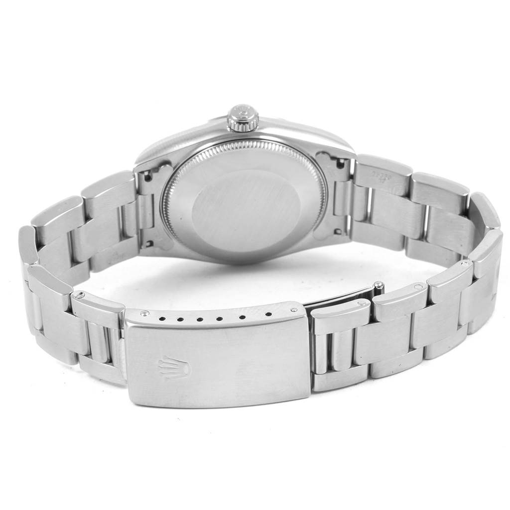 The image shows the backside and clasp of a Mid-Size Rolex watch, highlighting its stainless steel bracelet and case back.