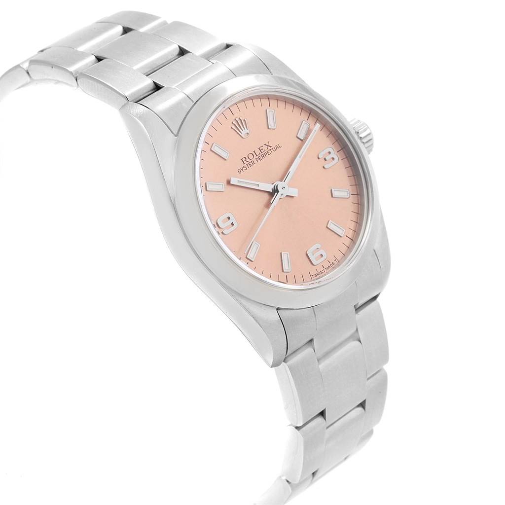 The image shows a side-angle view of a Rolex Mid-Size 67480 Women's Stainless Steel Pink Dial 67480 Women's Stainless Steel Pink Dial model, featuring the watch's band, case, and face.