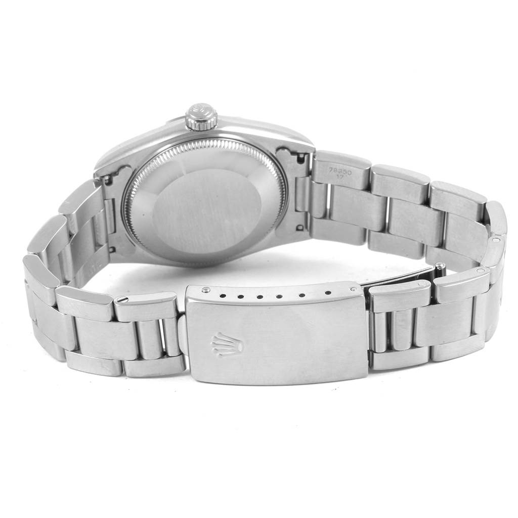 The image shows the back view of a Rolex Mid-Size 67480 Women's Stainless Steel Blue Dial 67480 Women's Stainless Steel Blue Dial watch, displaying the case back, bracelet, and clasp.