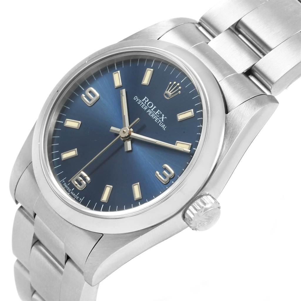 This image shows a front angle of a Rolex Mid-Size 67480 Women's Stainless Steel Blue Dial 67480 Women's Stainless Steel Blue Dial Oyster Perpetual watch with a blue dial and stainless steel bracelet.