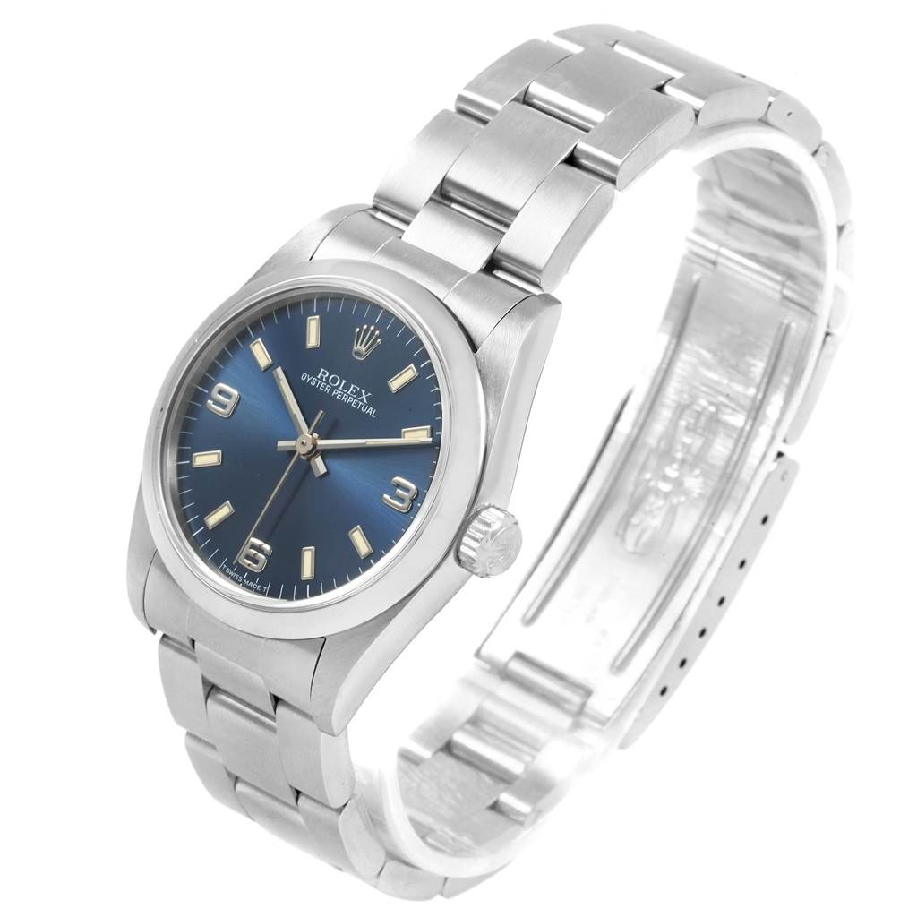 The Mid-Size Rolex watch is shown at a three-quarter angle displaying the face, crown, and full bracelet.