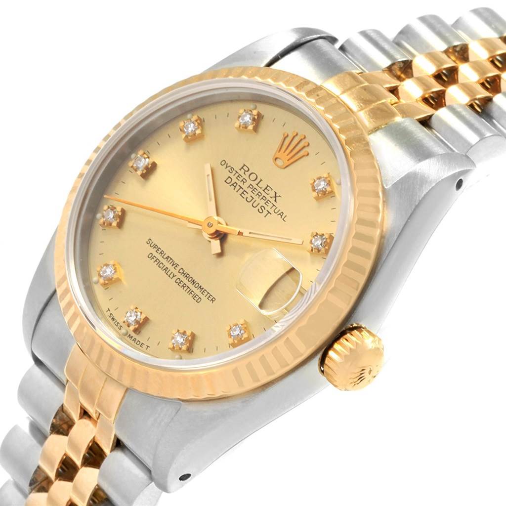 The image shows a Rolex Mid-Size 68273 Women's Steel and Gold (two tone) Champagne Dial 68273 Women's Steel and Gold (two tone) Champagne Dial Oyster Perpetual Datejust watch, angled to highlight the dial, crown, bezel, and a section of the bracelet.