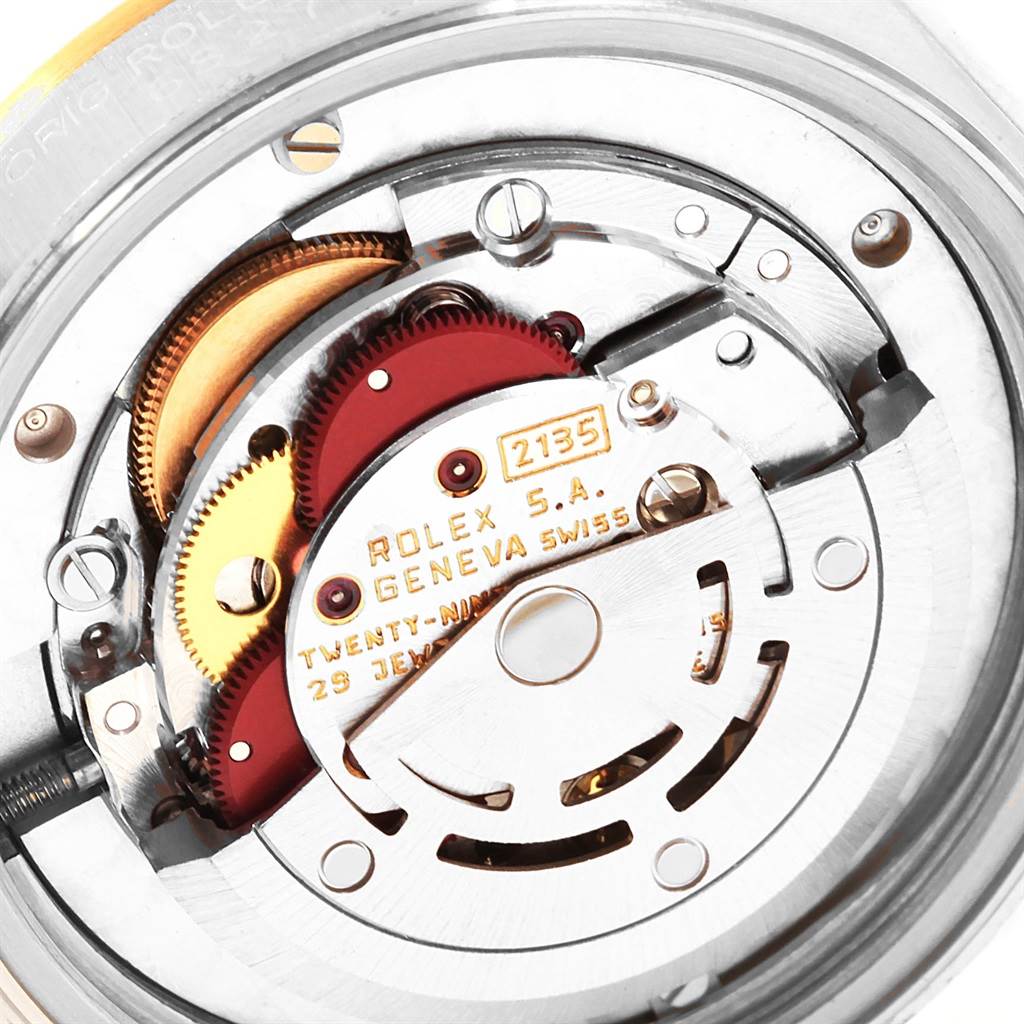 This image shows the internal movement mechanism of a Mid-Size Rolex watch, viewed from the back.
