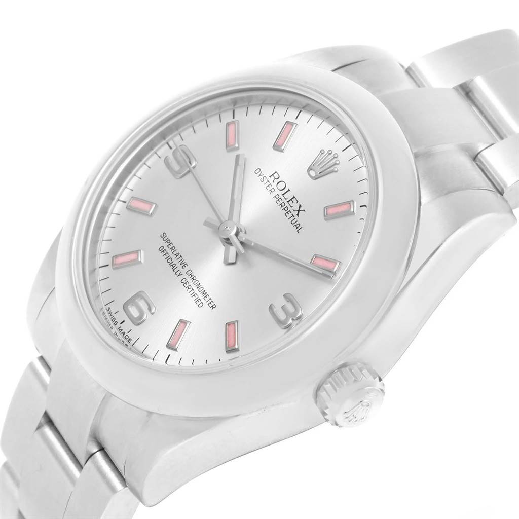 The image shows a Rolex Mid-Size 177200 Women's Stainless Steel Silver Dial 177200 Women's Stainless Steel Silver Dial Oyster Perpetual watch at an angle, highlighting the dial, crown, and part of the bracelet.