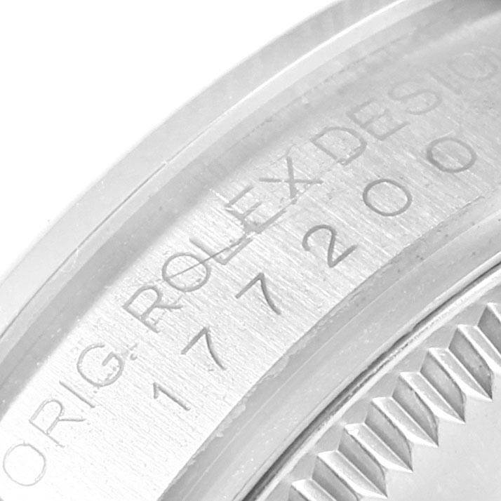 This image shows a close-up view of the engraved bezel edge and serial number on a Rolex Mid-Size 177200 Women's Stainless Steel Silver Dial 177200 Women's Stainless Steel Silver Dial watch.