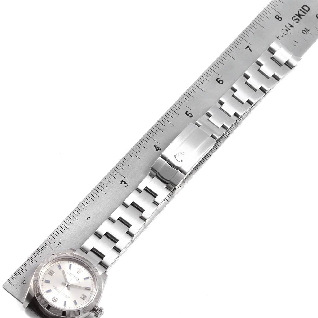 The image shows a top-view angle of a Rolex Mid-Size 177210 Women's Stainless Steel Silver Dial 177210 Women's Stainless Steel Silver Dial model watch and its stainless steel bracelet with a ruler for scale.