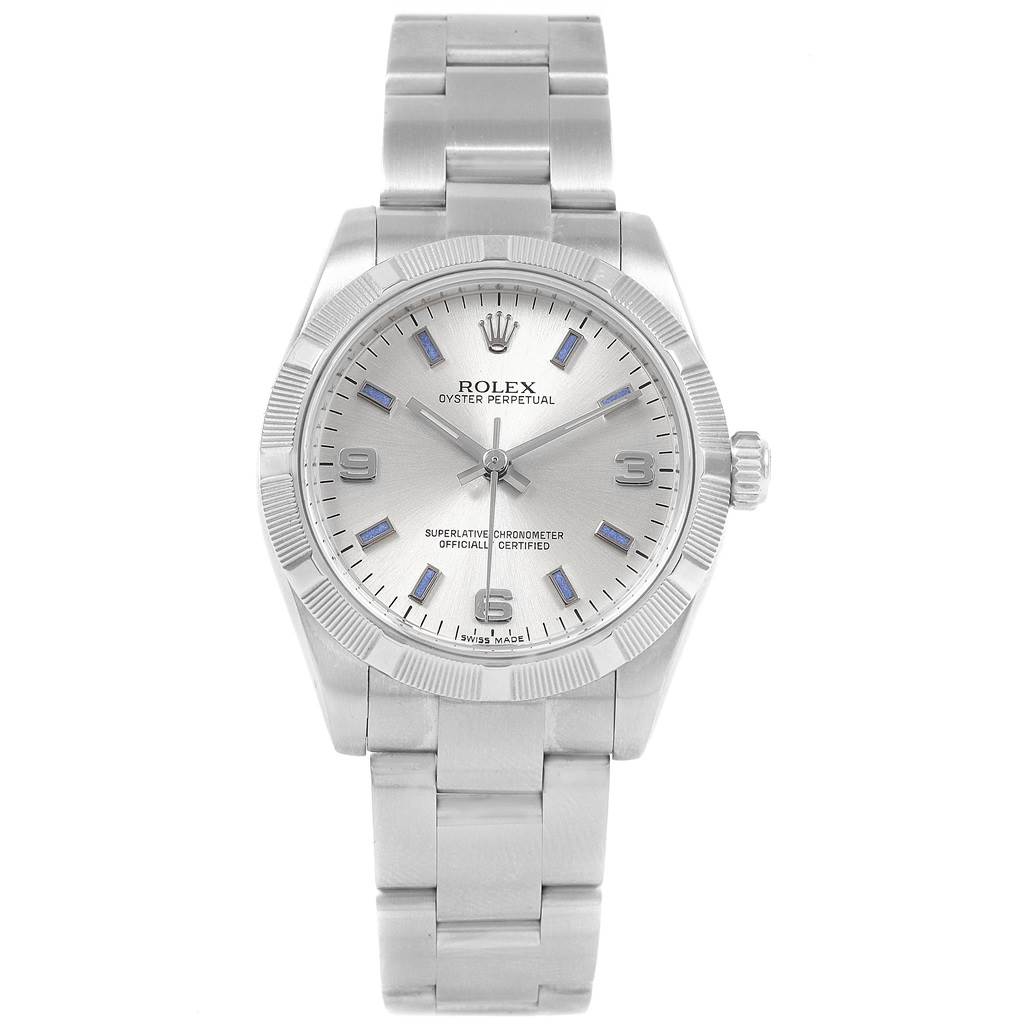 This image shows a Rolex Oyster Perpetual Mid-Size watch from a top-down angle, displaying the face, bezel, and bracelet.