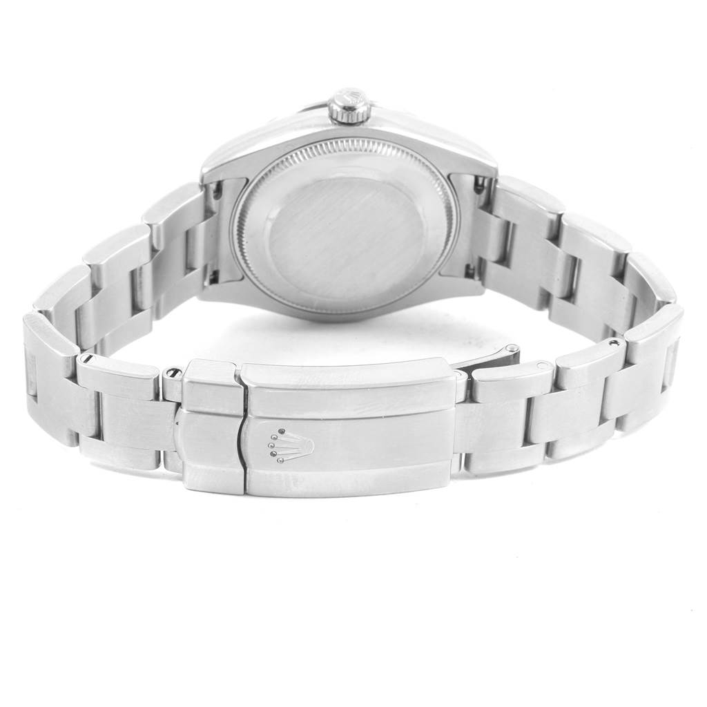 The image shows the back view of a Mid-Size Rolex watch, highlighting its closed clasp and stainless steel bracelet.