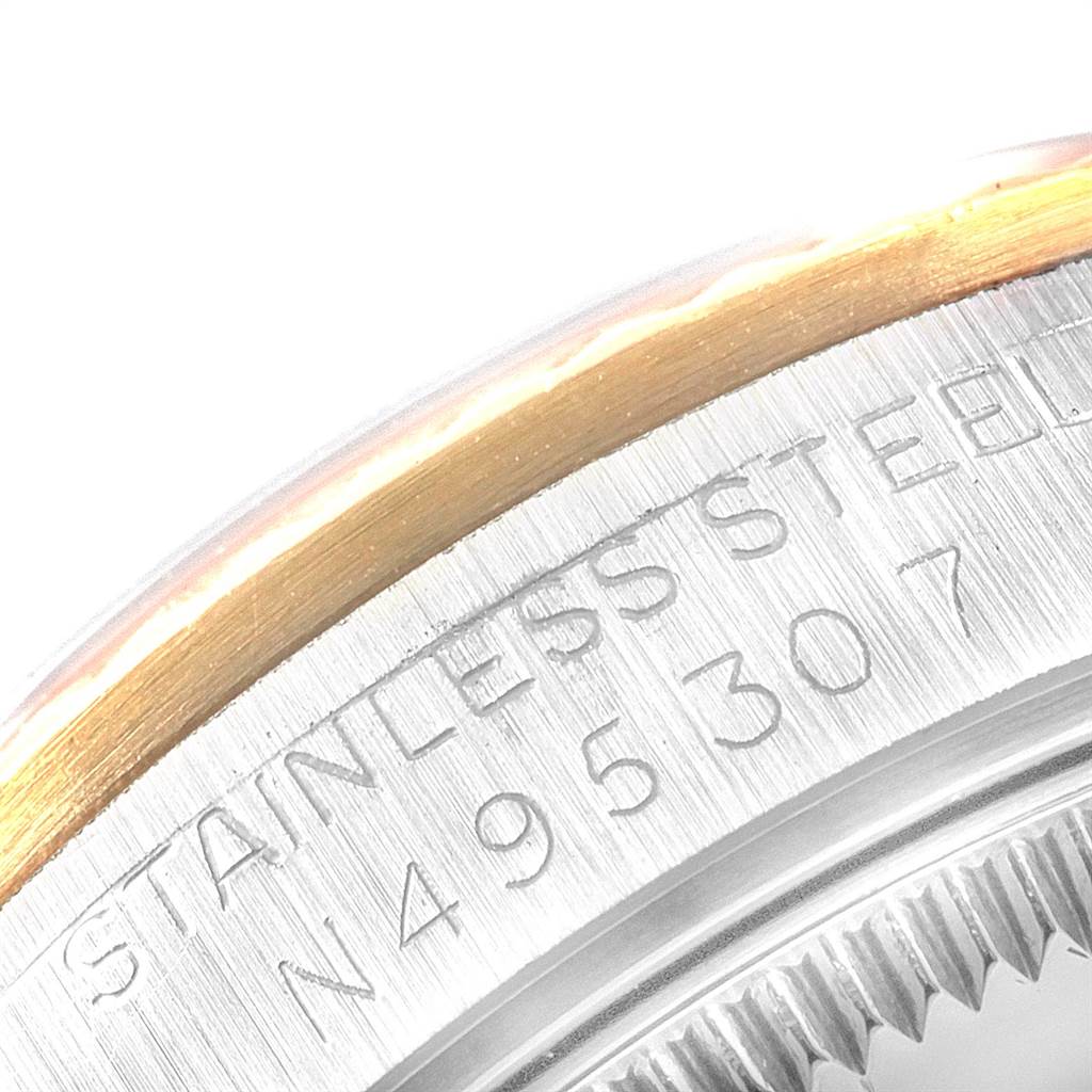 The image shows a close-up of the bezel and case back of a stainless steel and gold Rolex Mid-Size 68273 Women's Steel and Gold (two tone) Champagne Dial 68273 Women's Steel and Gold (two tone) Champagne Dial model watch.