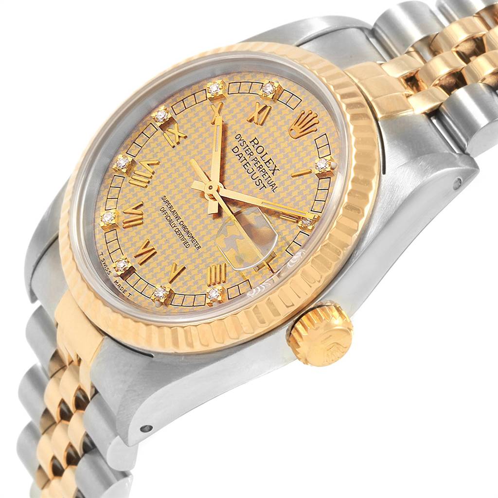 This image shows a close-up angle of a Rolex Mid-Size 68273 Women's Steel and Gold (two tone) Champagne Dial 68273 Women's Steel and Gold (two tone) Champagne Dial watch, highlighting its gold bezel, crown, and two-tone bracelet.